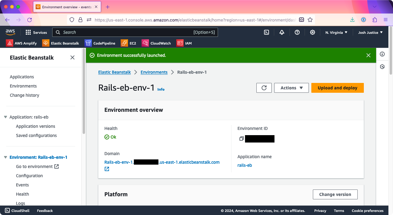 The 'Environment' page of Elastic Beanstalk, showing an environment named Rails-eb-env-1. Under 'Environment overview,' a domain is visible starting with the name of the environment.